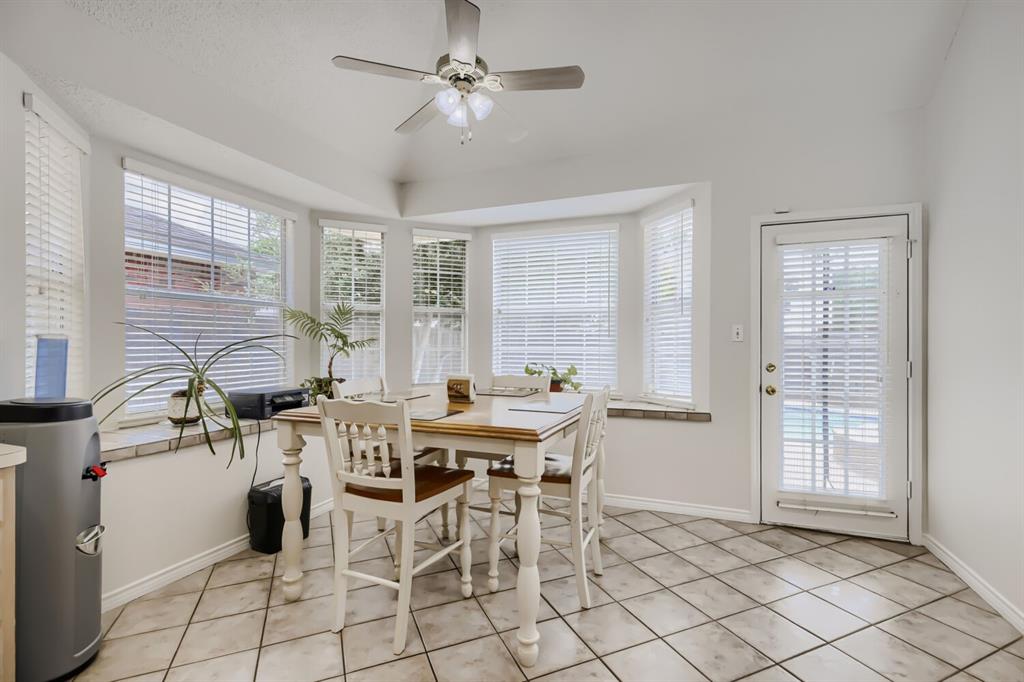 1413 West Peters Colony Road Carrollton, TX 75007 - Photo 14 of 29 a view of a dining room with furniture and window