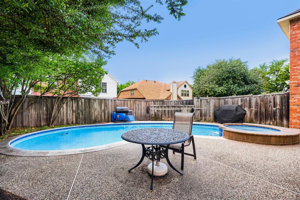 1413 West Peters Colony Road Carrollton, TX 75007 - Photo 27 of 29 a view of a backyard with a slide