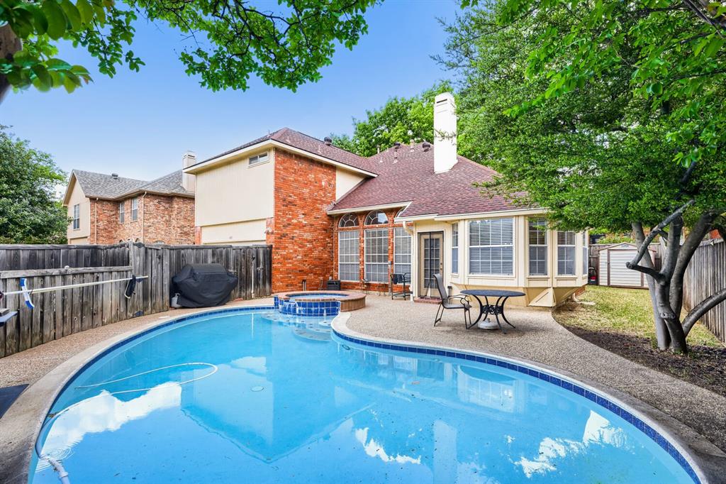 1413 West Peters Colony Road Carrollton, TX 75007 - Photo 28 of 29 a view of a house with swimming pool in front of it