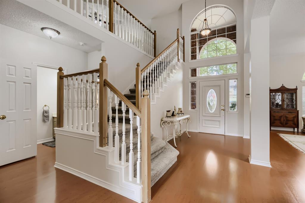 1413 West Peters Colony Road Carrollton, TX 75007 - Photo 4 of 29 a view of entryway and hall with wooden floor