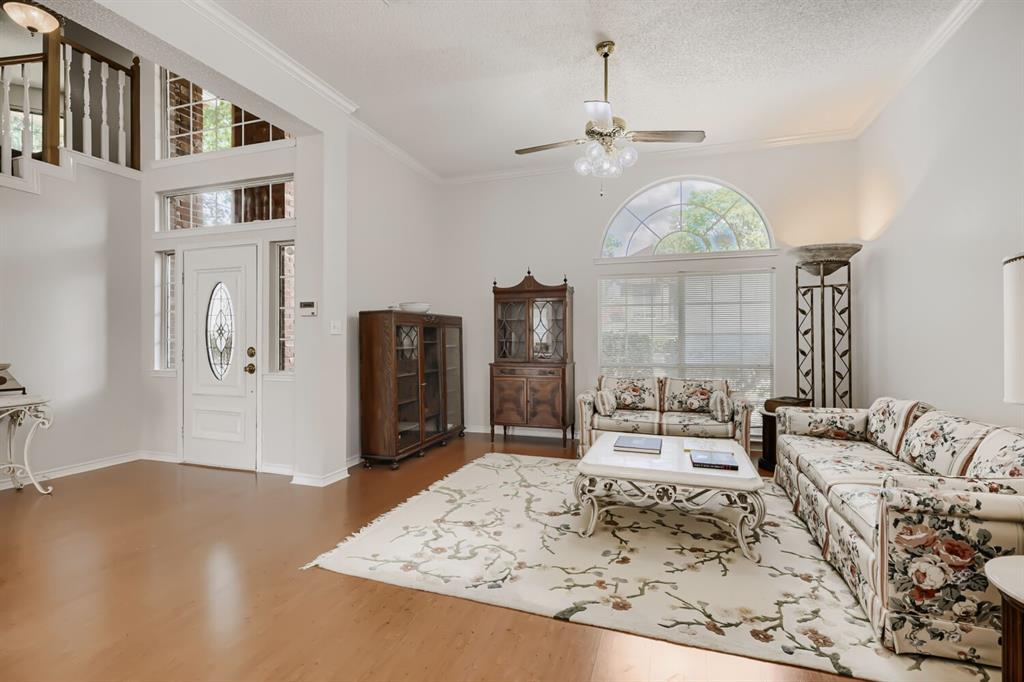 1413 West Peters Colony Road Carrollton, TX 75007 - Photo 5 of 29 a view of a bedroom with furniture window and wooden floor