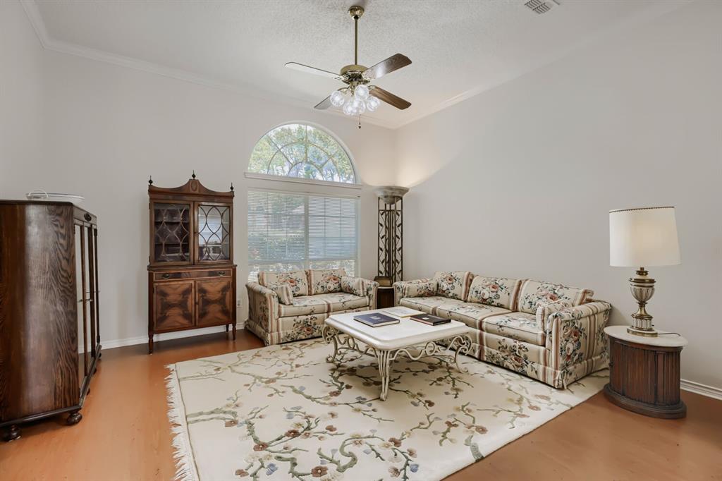 1413 West Peters Colony Road Carrollton, TX 75007 - Photo 6 of 29 a living room with furniture a chandelier and a window