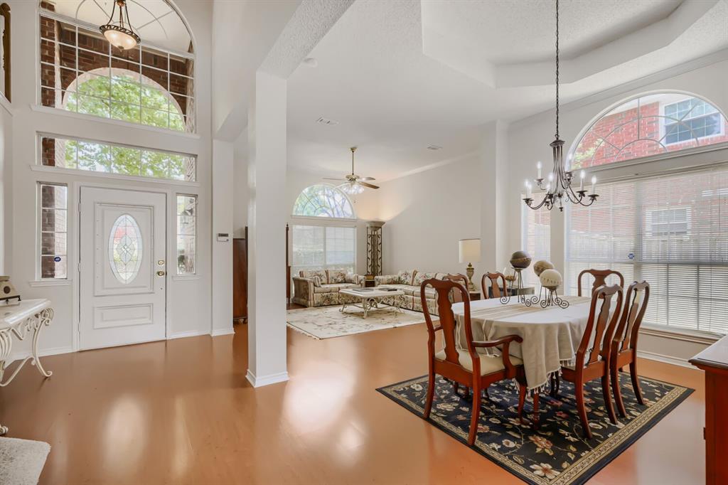 1413 West Peters Colony Road Carrollton, TX 75007 - Photo 7 of 29 a view of a dining room with furniture window and wooden floor