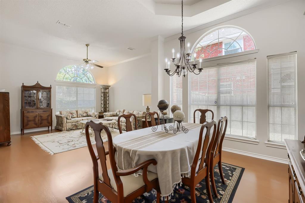 1413 West Peters Colony Road Carrollton, TX 75007 - Photo 8 of 29 a view of a dining room with furniture window and wooden floor