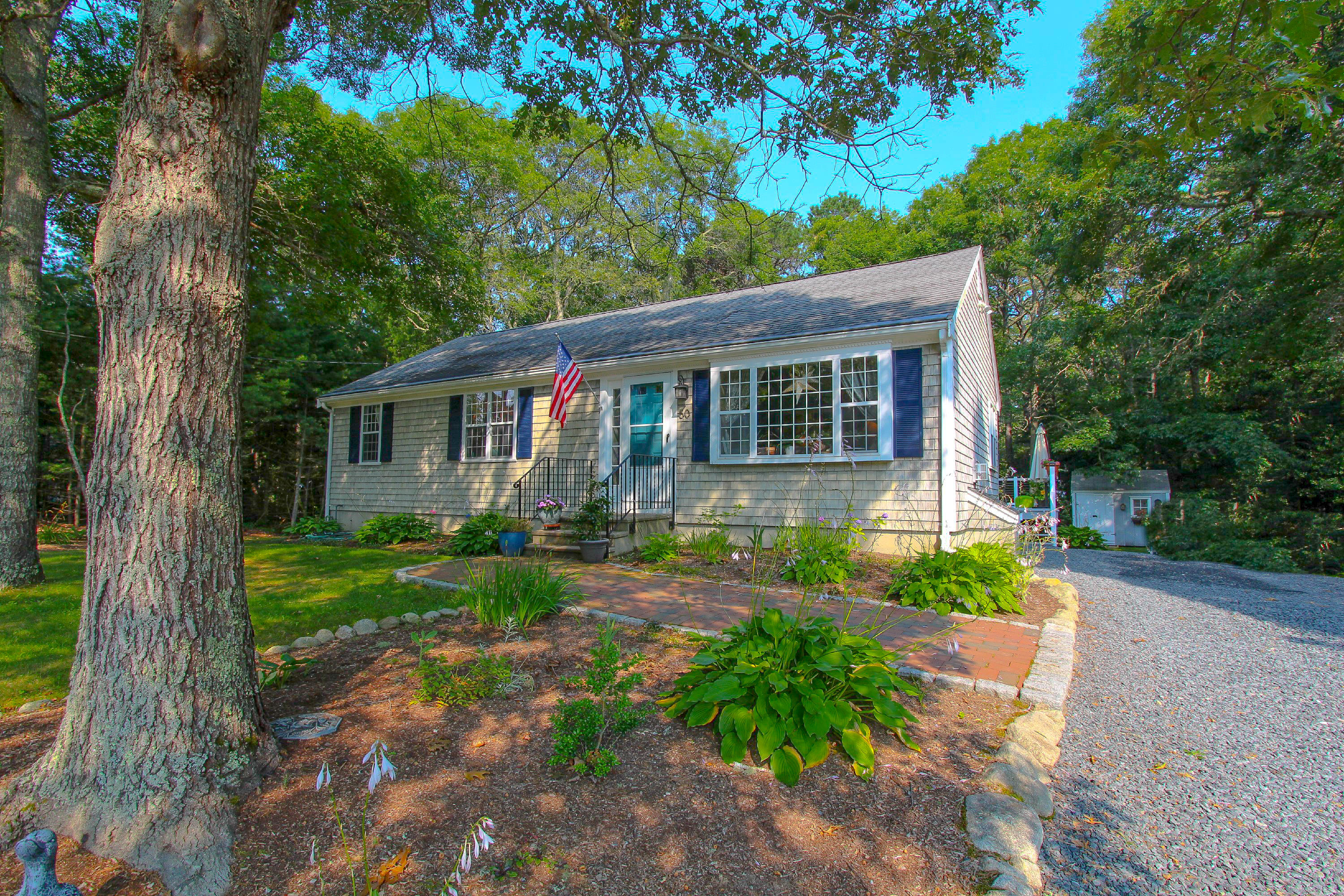 50 Ensign Road Centerville, MA 02632 - Photo 1 of 21 front view of a house with a yard