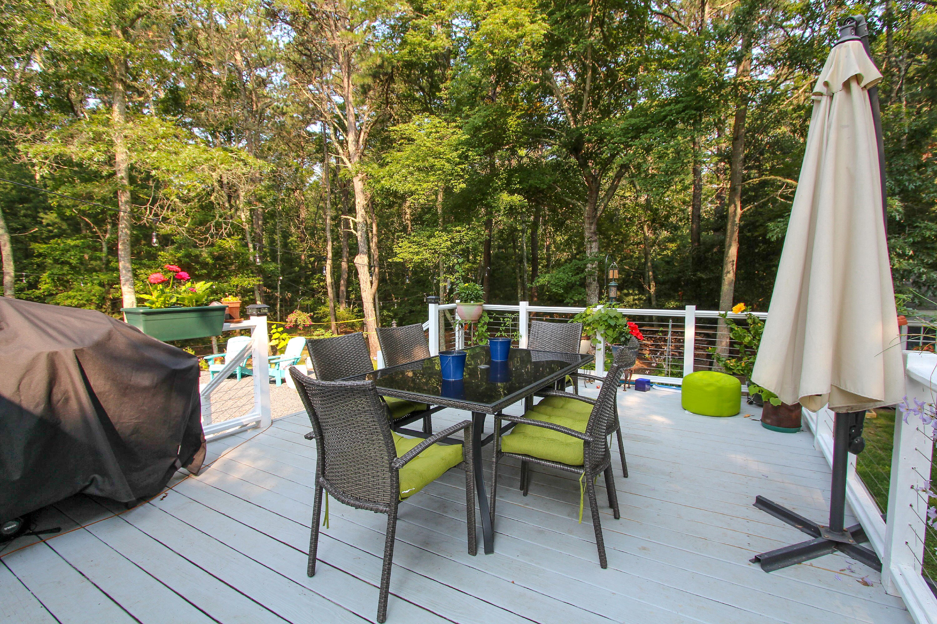 50 Ensign Road Centerville, MA 02632 - Photo 17 of 21 a view of a chairs and table in patio with a backyard