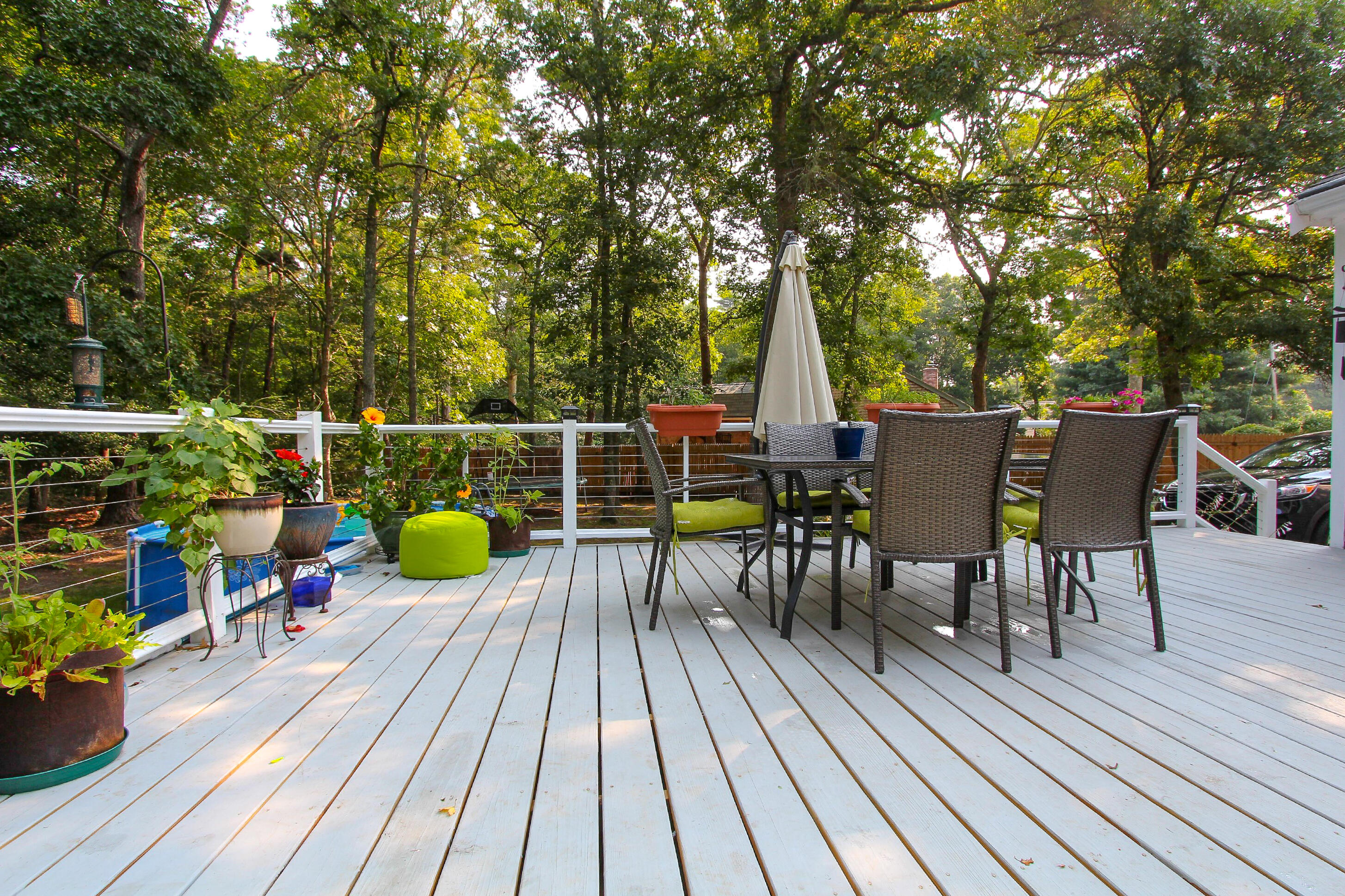 50 Ensign Road Centerville, MA 02632 - Photo 18 of 21 a view of deck with table and chairs wooden floor and fence