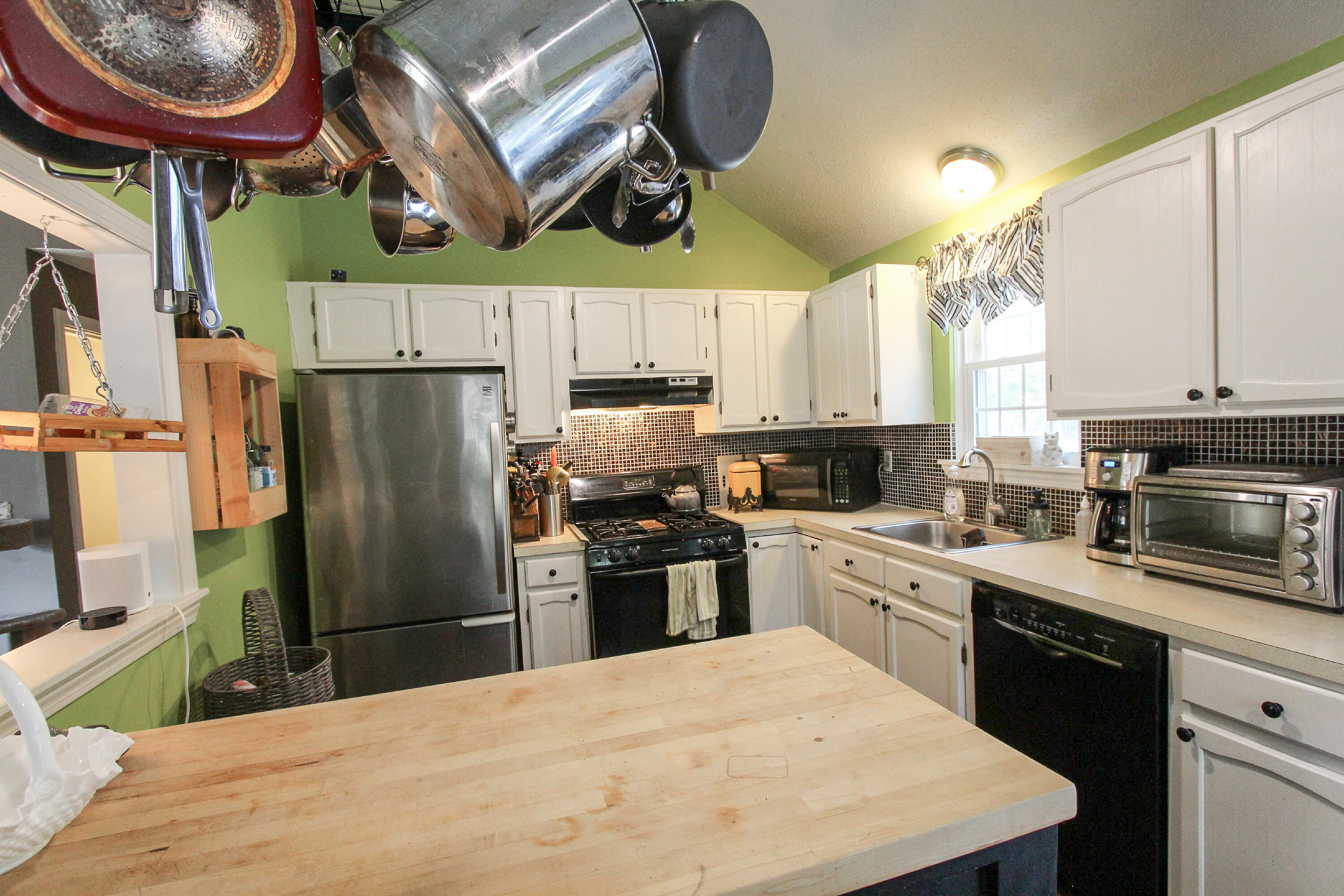 50 Ensign Road Centerville, MA 02632 - Photo 3 of 21 a kitchen with stainless steel appliances granite countertop a refrigerator a stove a sink and a microwave