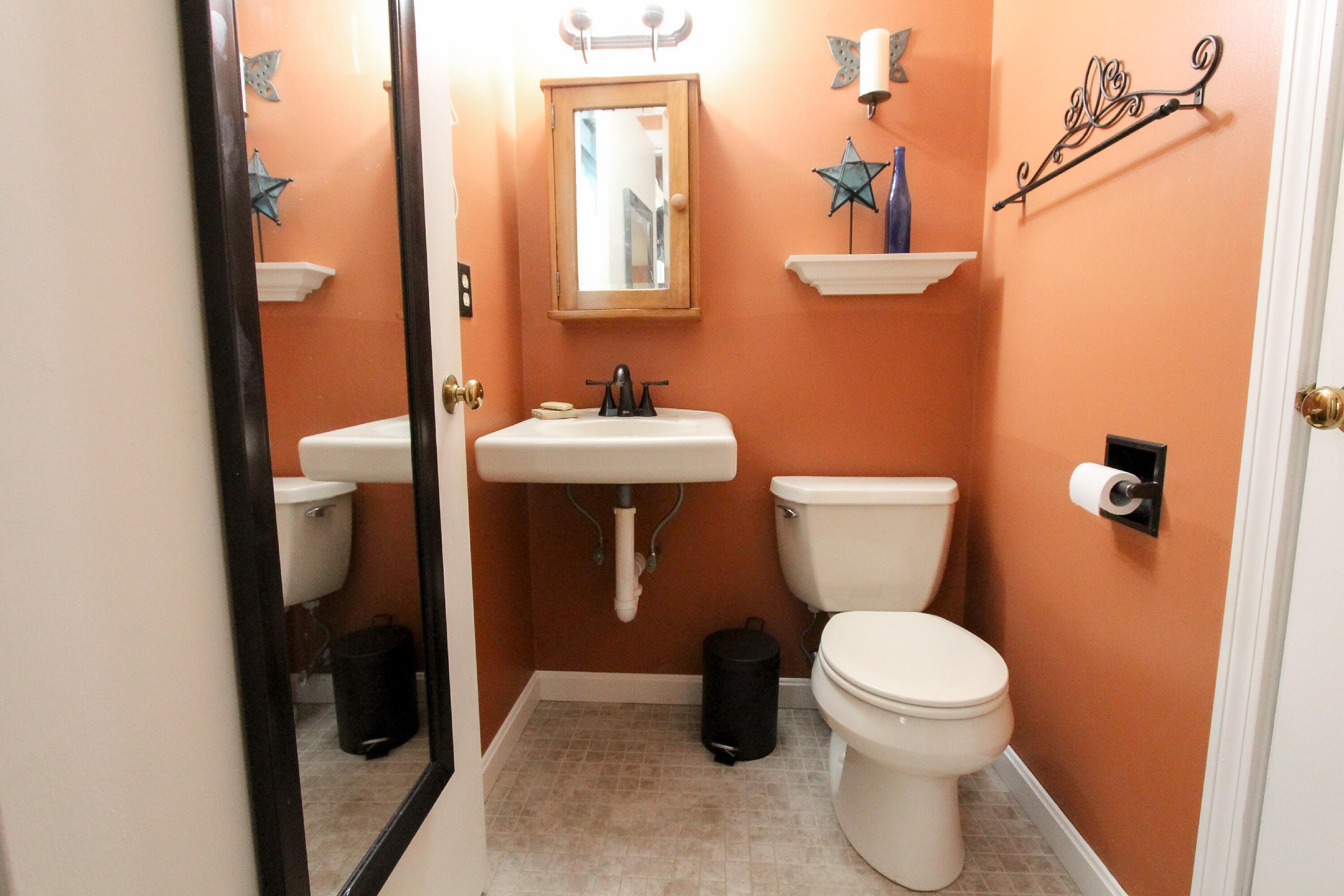 50 Ensign Road Centerville, MA 02632 - Photo 9 of 21 a bathroom with a toilet a sink and a mirror
