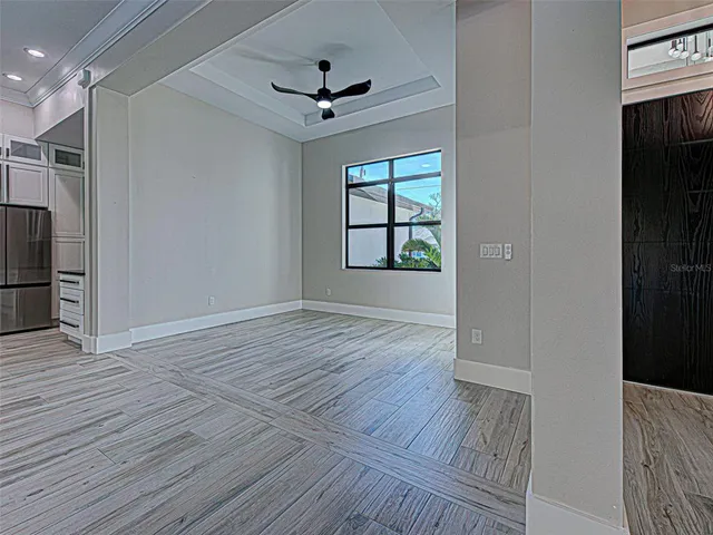 wooden floor in an empty room with a window