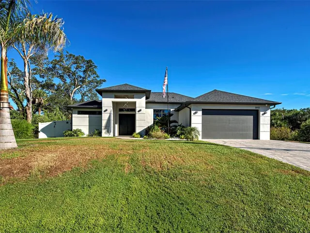a close up of a potted plant in front of a house