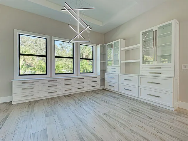 a kitchen with stainless steel appliances granite countertop a refrigerator and a stove