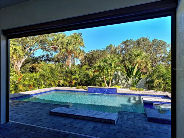 a kitchen view of a kitchen appliances and a window