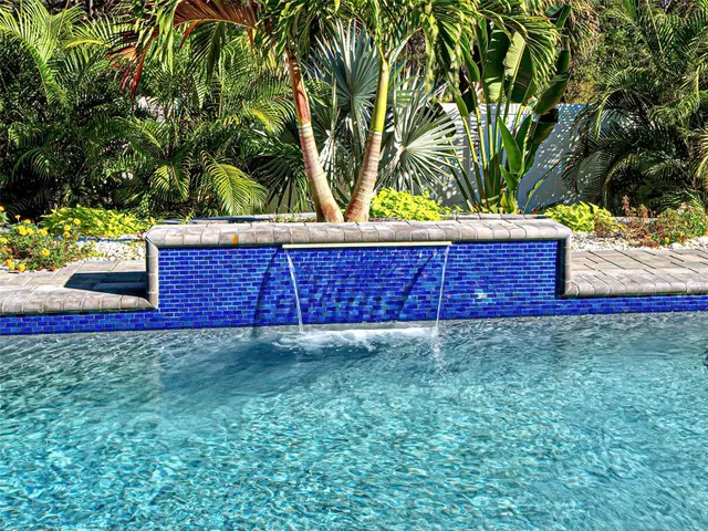 a view of a house with backyard and porch