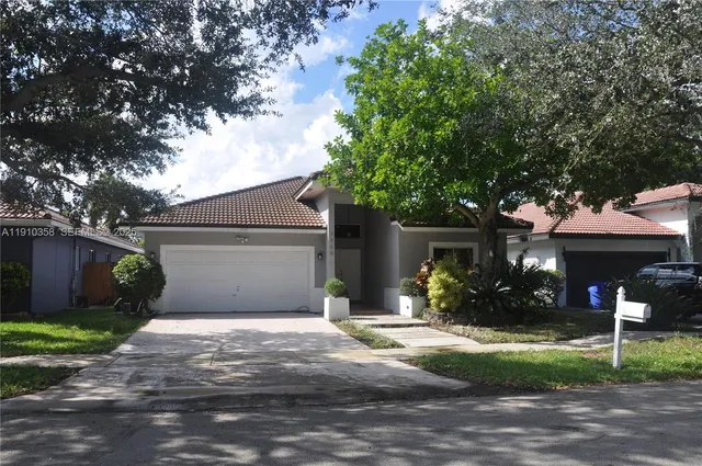 a front view of a house with yard