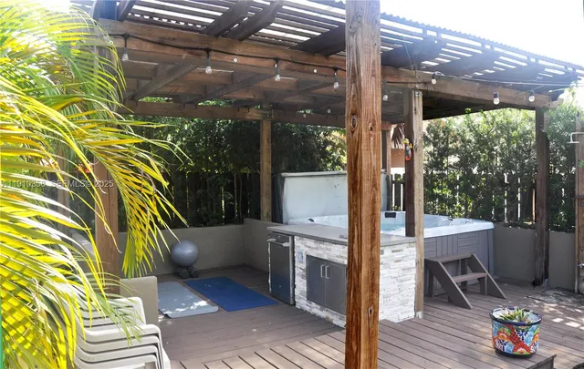 a view of porch with a chair and potted plant