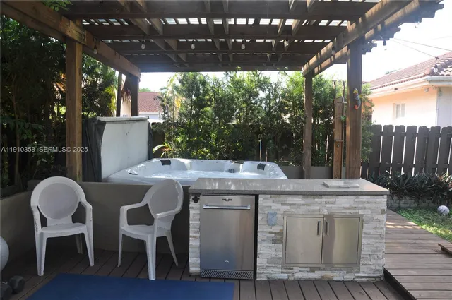 a view of a chairs and table in the patio