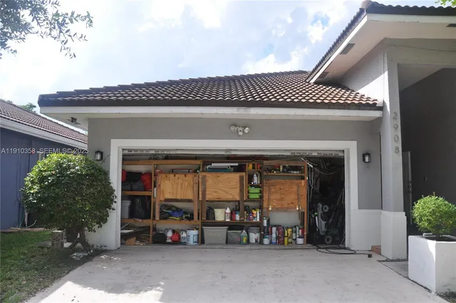 a view of a car park in front of house