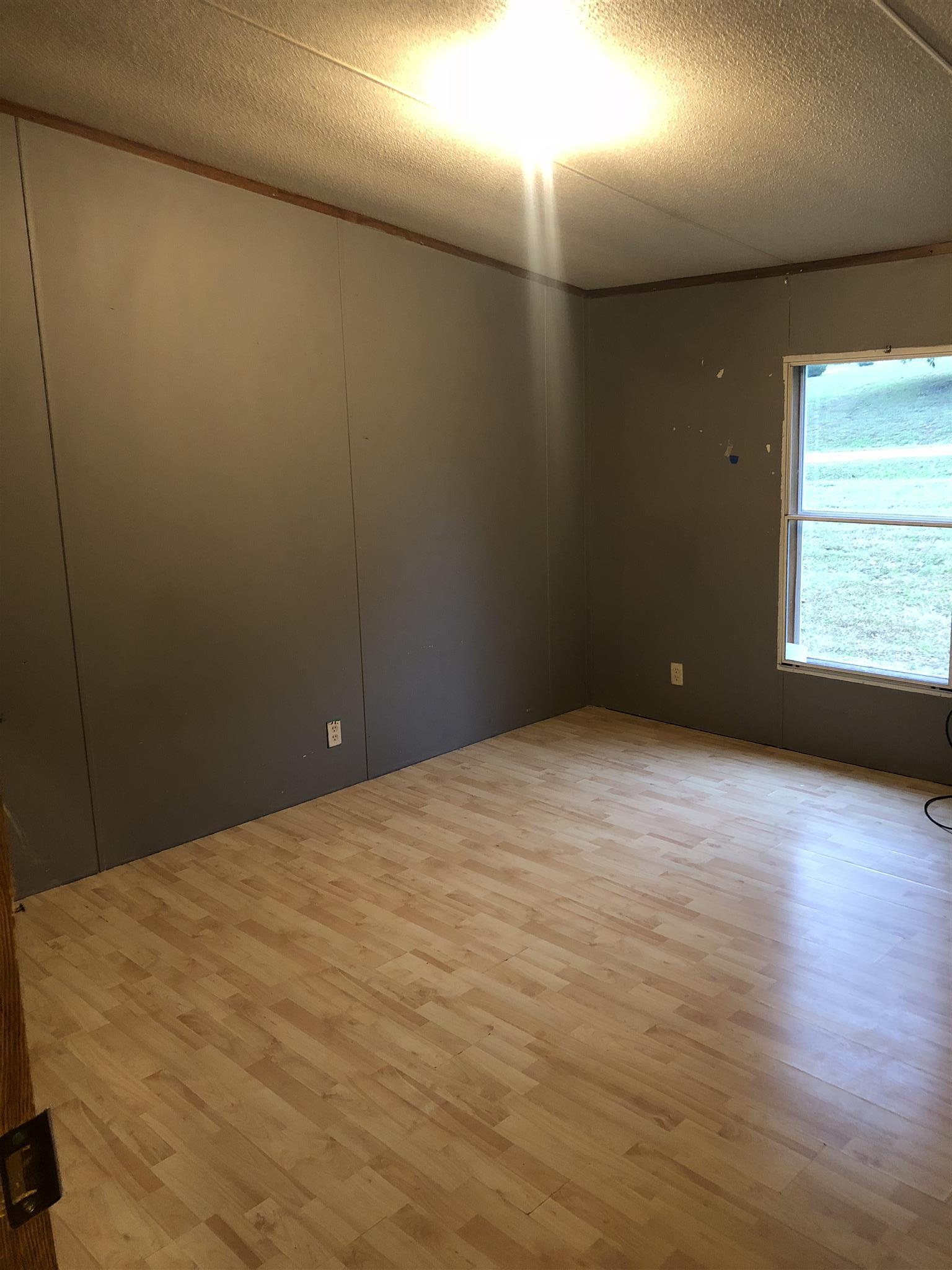 173 Roberts Road Portland, TN 37148 - Photo 7 of 7 a view of an empty room with a window