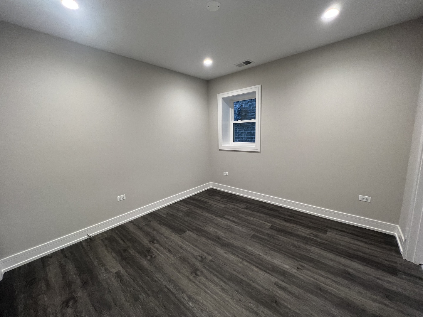 Undisclosed Address Chicago, IL 60640 - Photo 13 of 15 a view of an empty room with wooden floor and a window