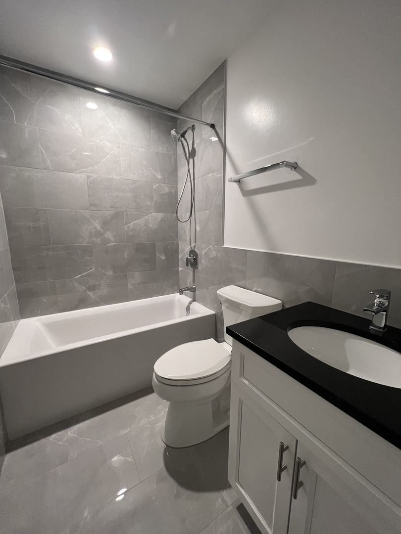 Undisclosed Address Chicago, IL 60640 - Photo 15 of 15 a bathroom with a granite countertop sink mirror vanity and toilet