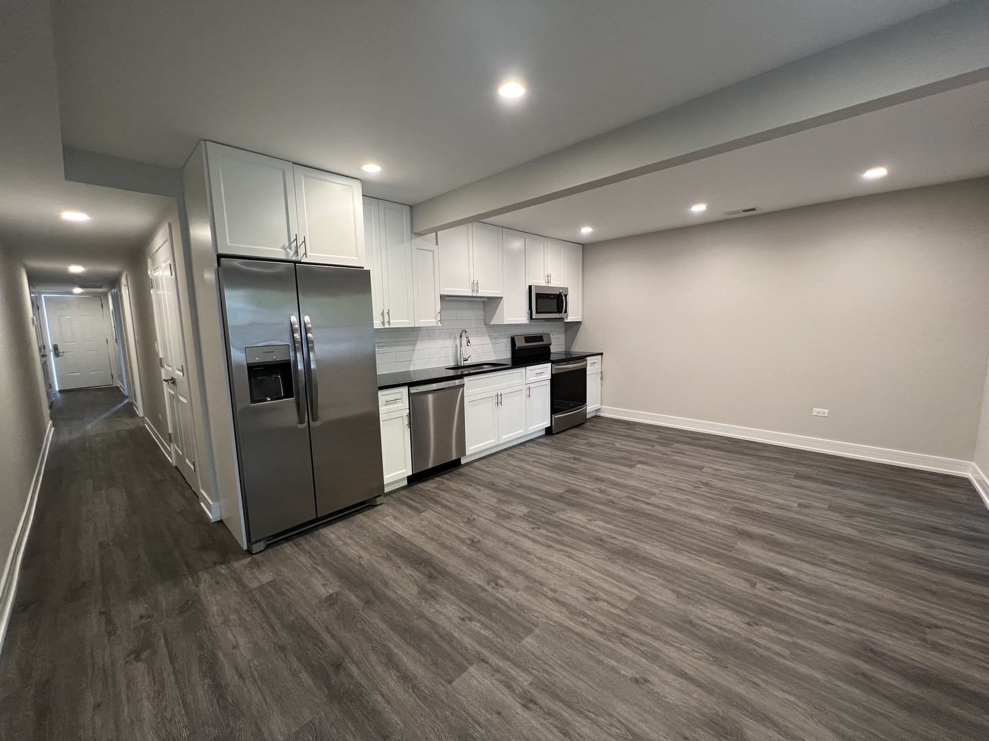 Undisclosed Address Chicago, IL 60640 - Photo 3 of 15 a kitchen with stainless steel appliances a refrigerator and a stove top oven