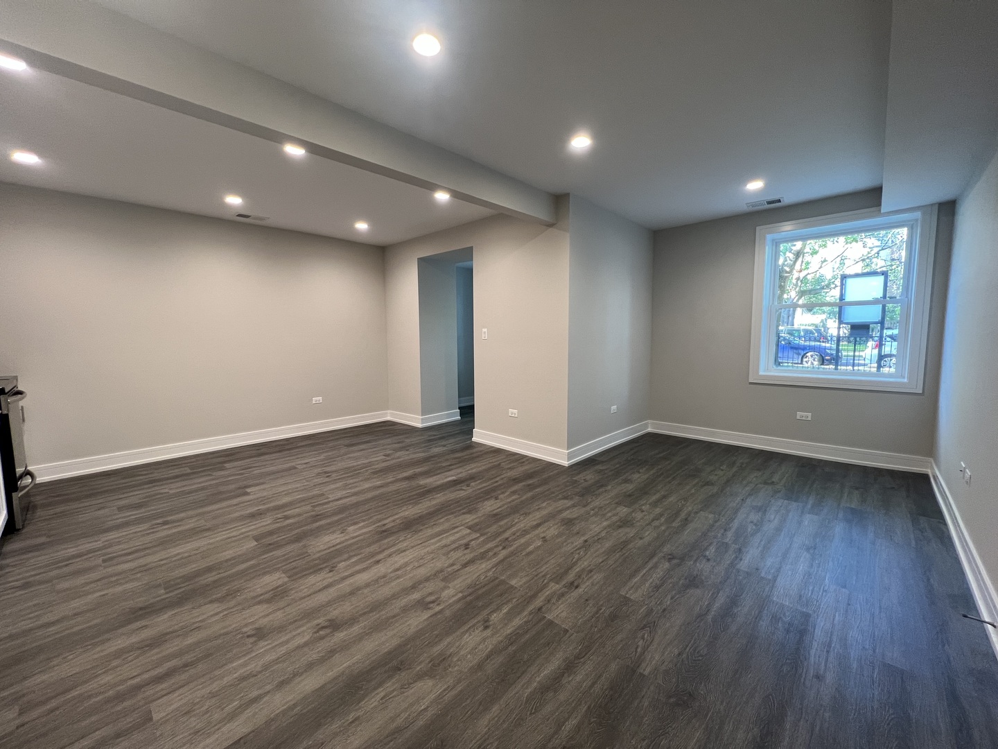 Undisclosed Address Chicago, IL 60640 - Photo 4 of 15 an empty room with wooden floor and windows
