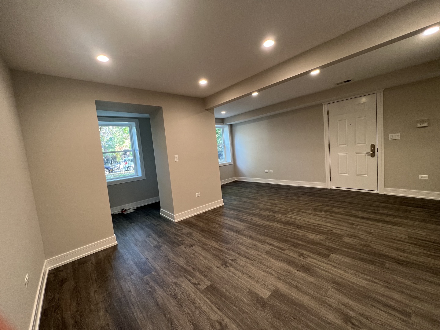 Undisclosed Address Chicago, IL 60640 - Photo 5 of 15 an empty room with wooden floor and windows