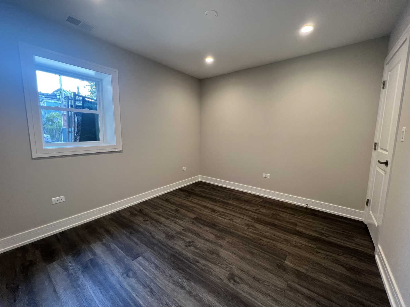Undisclosed Address Chicago, IL 60640 - Photo 7 of 15 a view of an empty room with wooden floor and a window