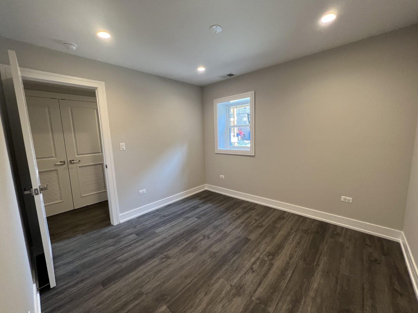 Undisclosed Address Chicago, IL 60640 - Photo 9 of 15 an empty room with wooden floor and windows