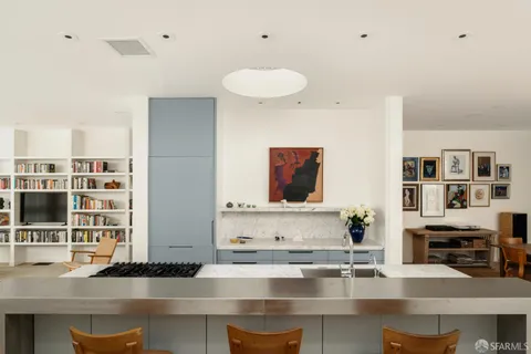 a kitchen with stainless steel appliances granite countertop a stove and a sink