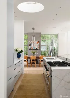 a view of a dining table and a window in a room