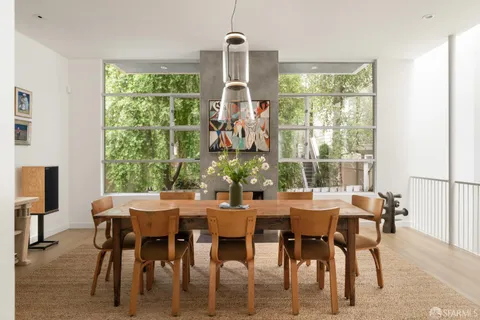 a view of a dining room with furniture window and outside view