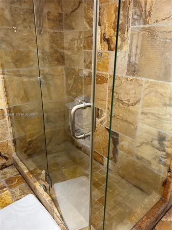 a bathroom with a sink and a large mirror