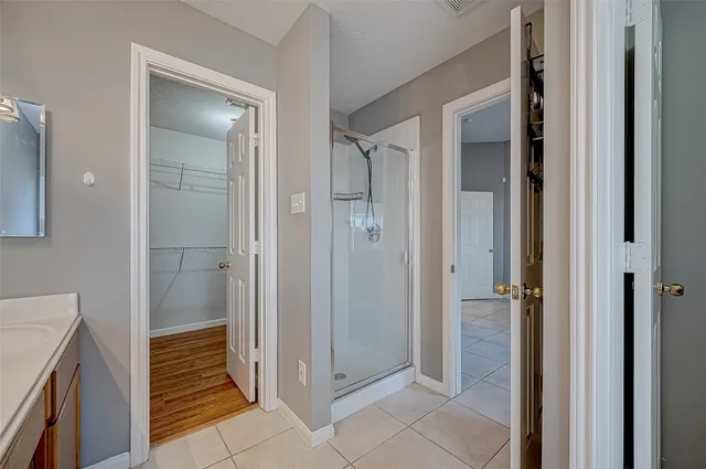 a bathroom with a shower and toilet