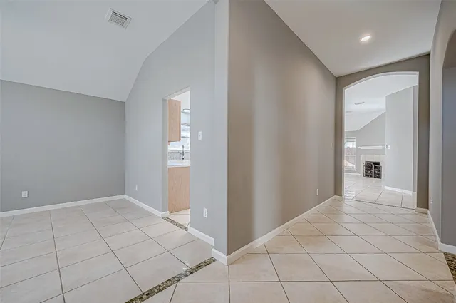 a view of an empty room and closet area
