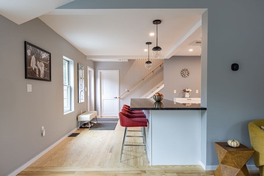 136 Topsfield Road Ipswich, MA 01938 - Photo 3 of 13 a room with table and gym equipment