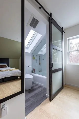 a bathroom with a bathtub and a toilet