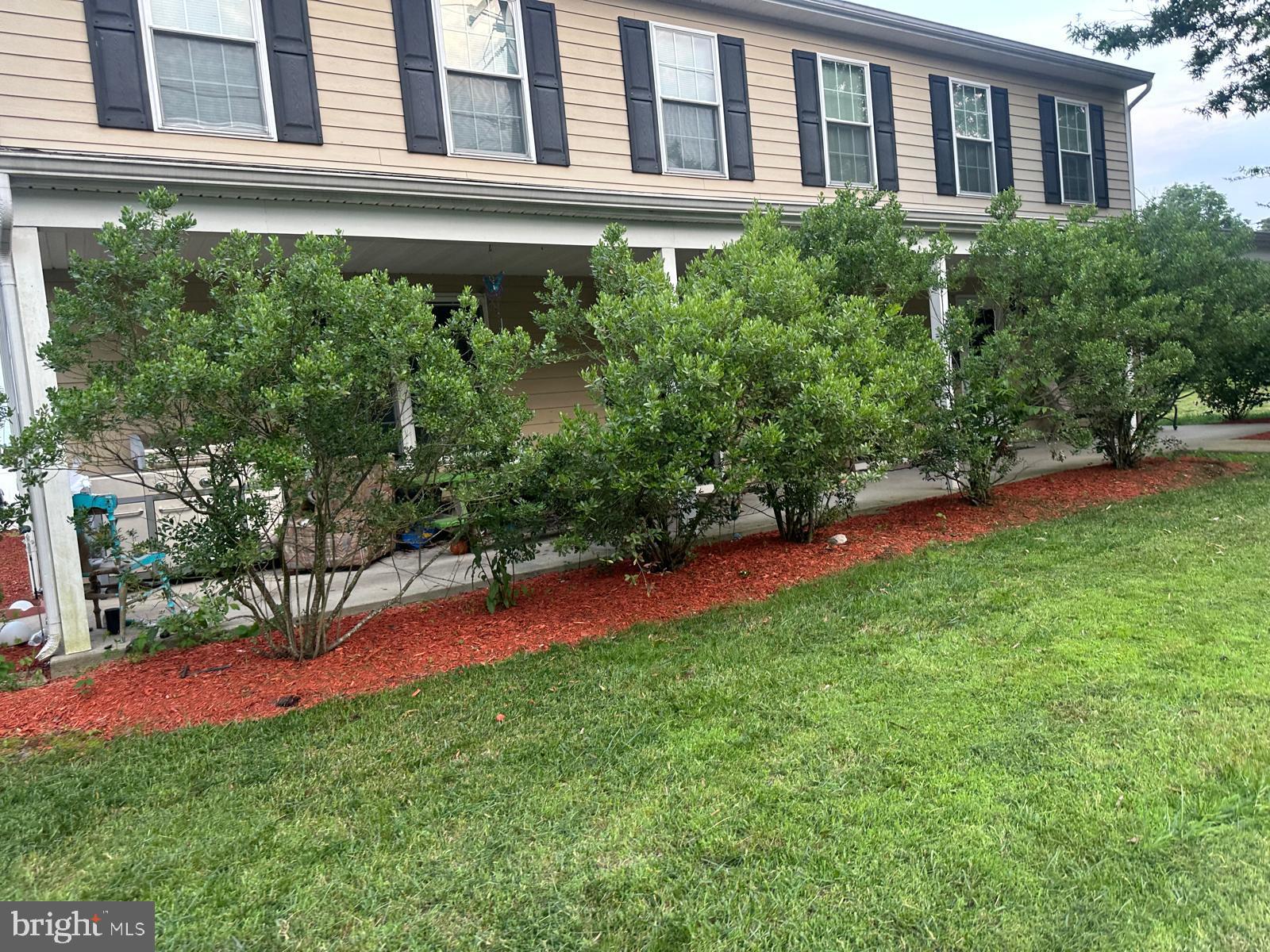 2201 Burlington Avenue Delanco, NJ 08075 - Photo 13 of 13 a view of a backyard with plants and a bench
