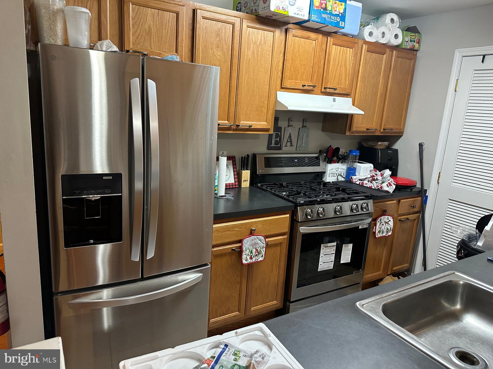 2201 Burlington Avenue Delanco, NJ 08075 - Photo 10 of 13 a kitchen with stainless steel appliances granite countertop a refrigerator a stove and a sink with wooden floors