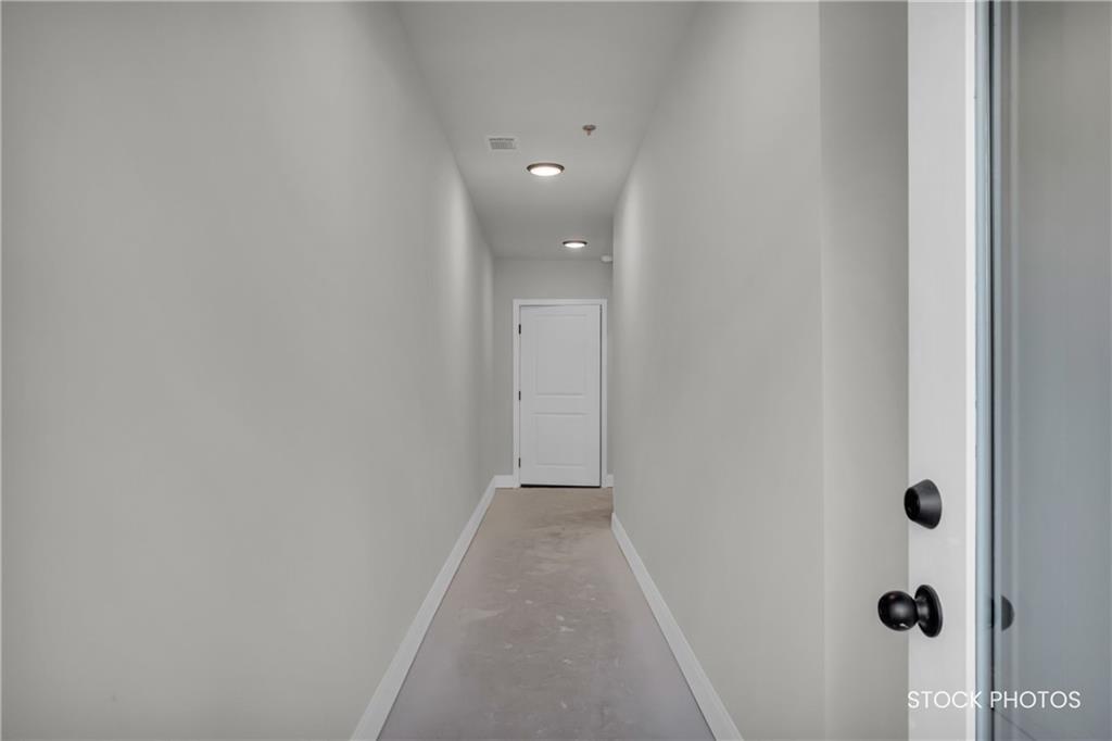 1038 Homestead Way Street Dacula, GA 30019 - Photo 19 of 36 a view of a hallway with closet