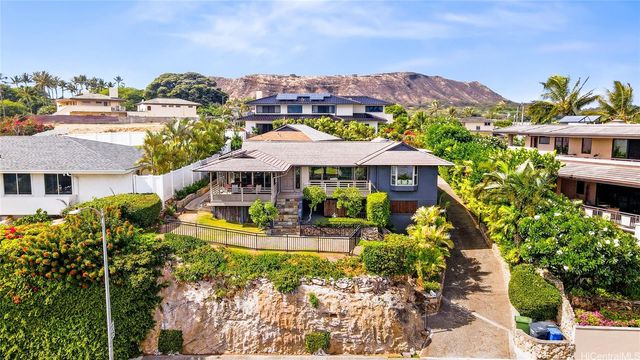 a front view of a house with a ocean view