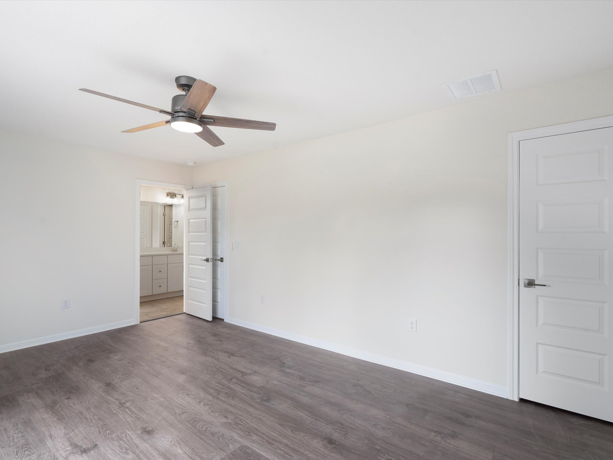 21007 Coleman Branch Creek Road Manor, TX 78653 - Photo 22 of 30 Spacious primary bedroom with natural light and peaceful views.