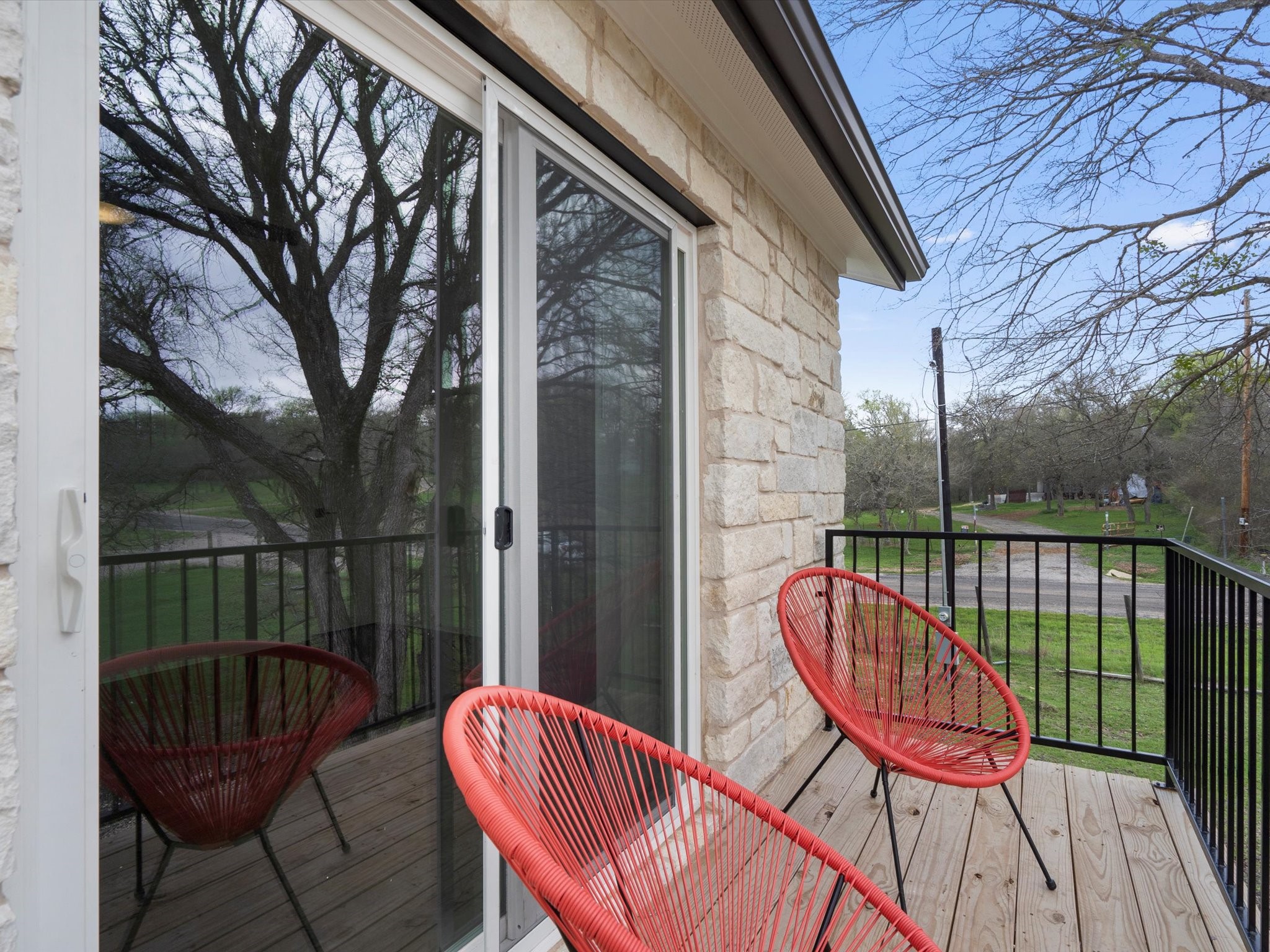 21007 Coleman Branch Creek Road Manor, TX 78653 - Photo 24 of 30 Outdoor balcony overlooking the peaceful landscape.