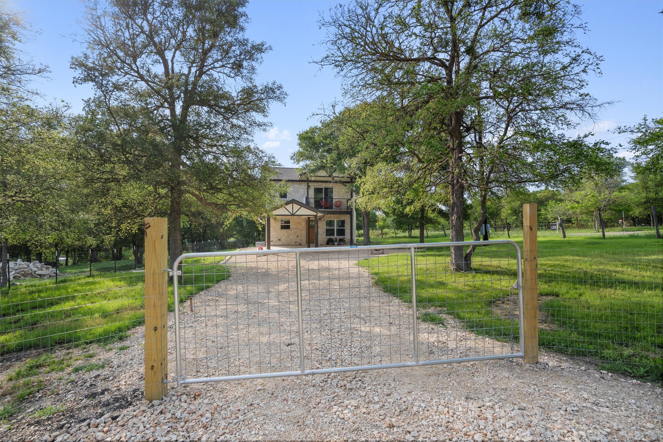 21007 Coleman Branch Creek Road Manor, TX 78653 - Photo 4 of 30 Private gated entrance welcoming you onto the property.