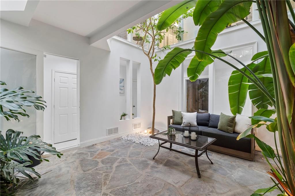 11260 Houze Road Roswell, GA 30076 - Photo 17 of 60 a living room with furniture and a potted plant