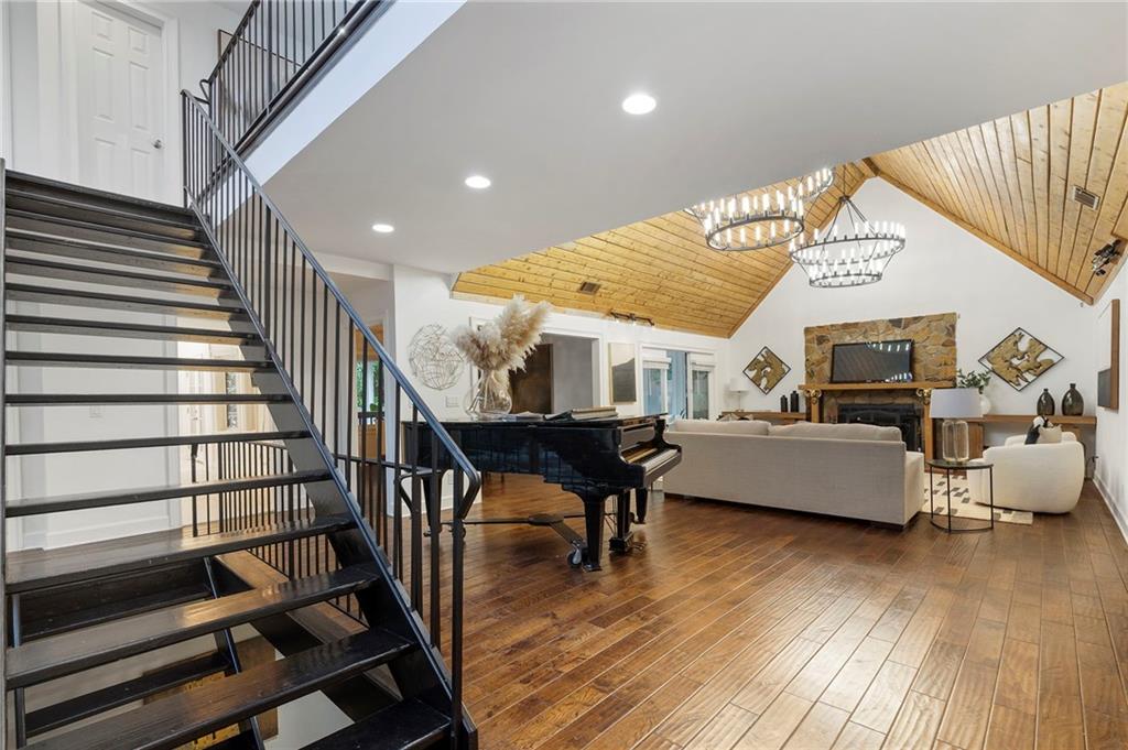 11260 Houze Road Roswell, GA 30076 - Photo 19 of 60 a living room with furniture and a wooden floor