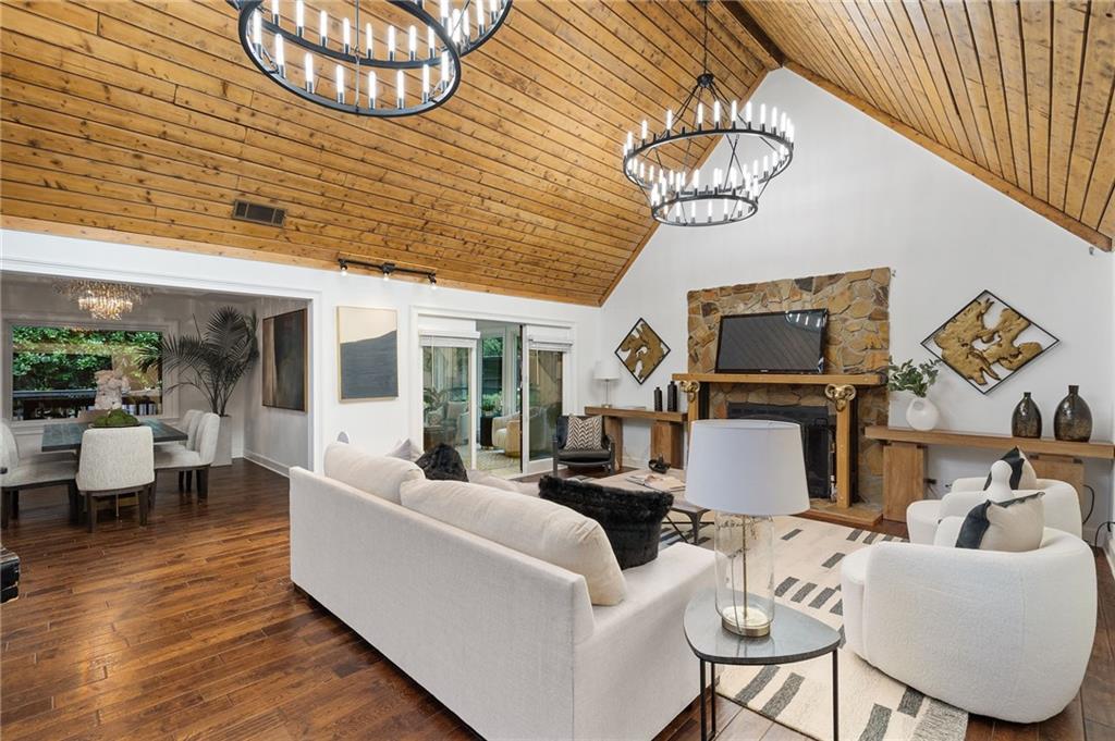 11260 Houze Road Roswell, GA 30076 - Photo 22 of 60 a living room with furniture a flat screen tv and a table