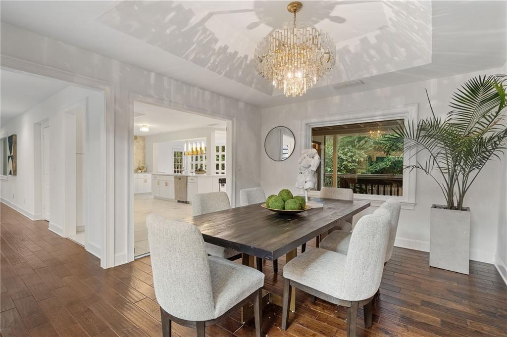 11260 Houze Road Roswell, GA 30076 - Photo 25 of 60 a view of a dining room with furniture window and wooden floor