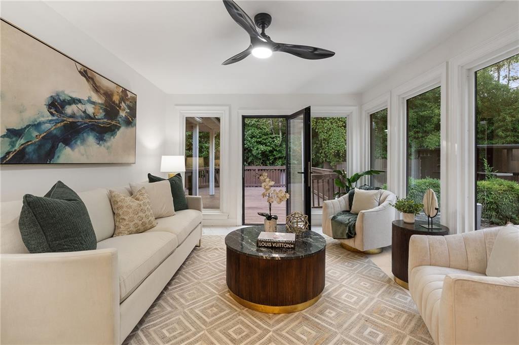 11260 Houze Road Roswell, GA 30076 - Photo 26 of 60 a living room with furniture and a large window